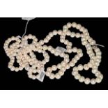 Three pearl necklaces, longest 88cm.