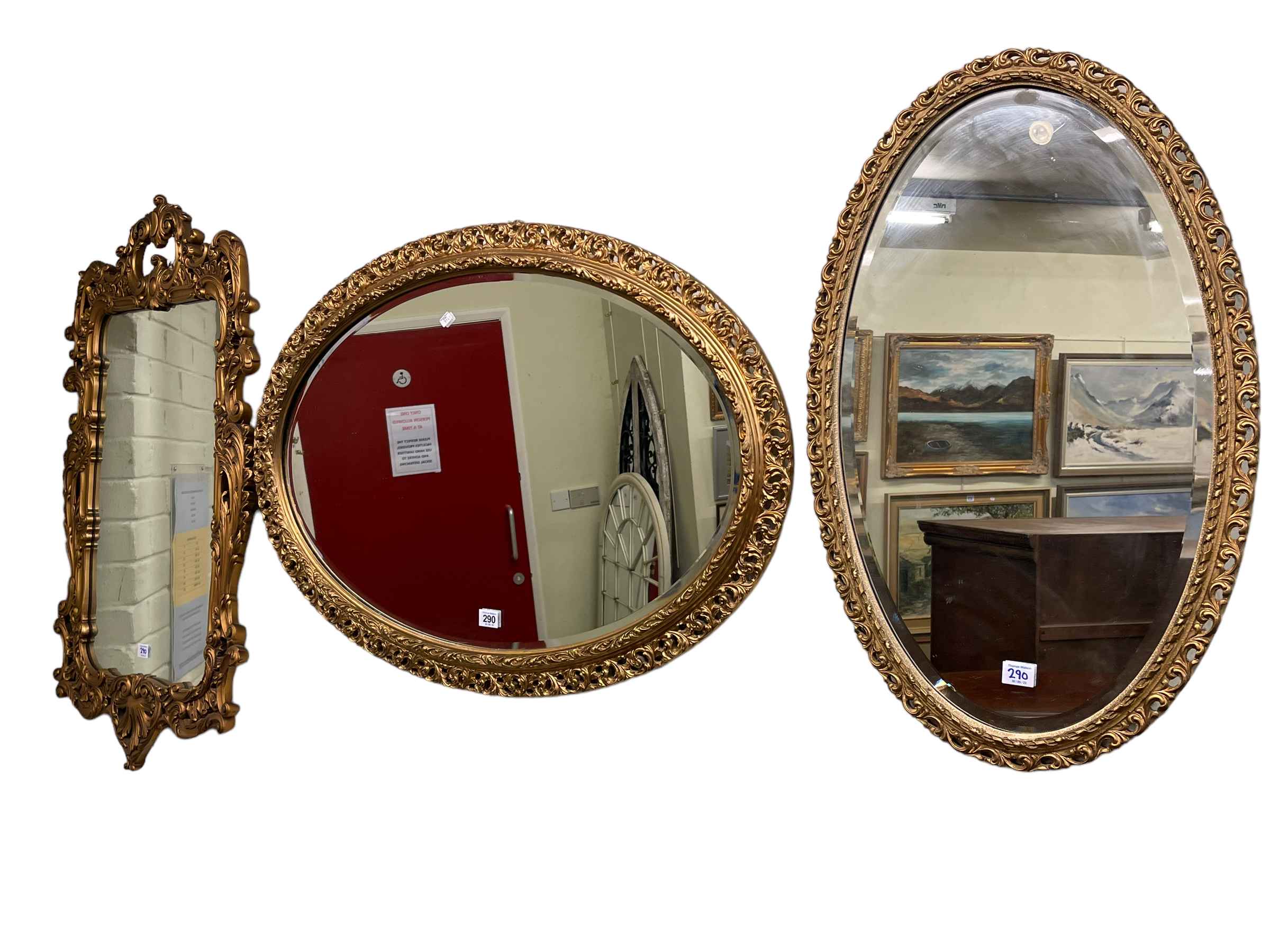 Collection of three gilt framed wall mirrors including two oval bevelled.