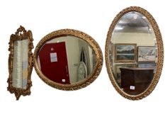 Collection of three gilt framed wall mirrors including two oval bevelled.