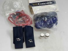 Collection of Concorde memorabilia including pens, signed boarding cards, headphones,