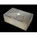 Rectangular silver engine turned silver cigarette box, London 1930.