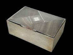 Rectangular silver engine turned silver cigarette box, London 1930.