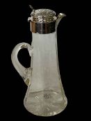 Edwardian silver topped claret jug, with embossed and chased hinged lid, Birmingham 1905, 27cm high.