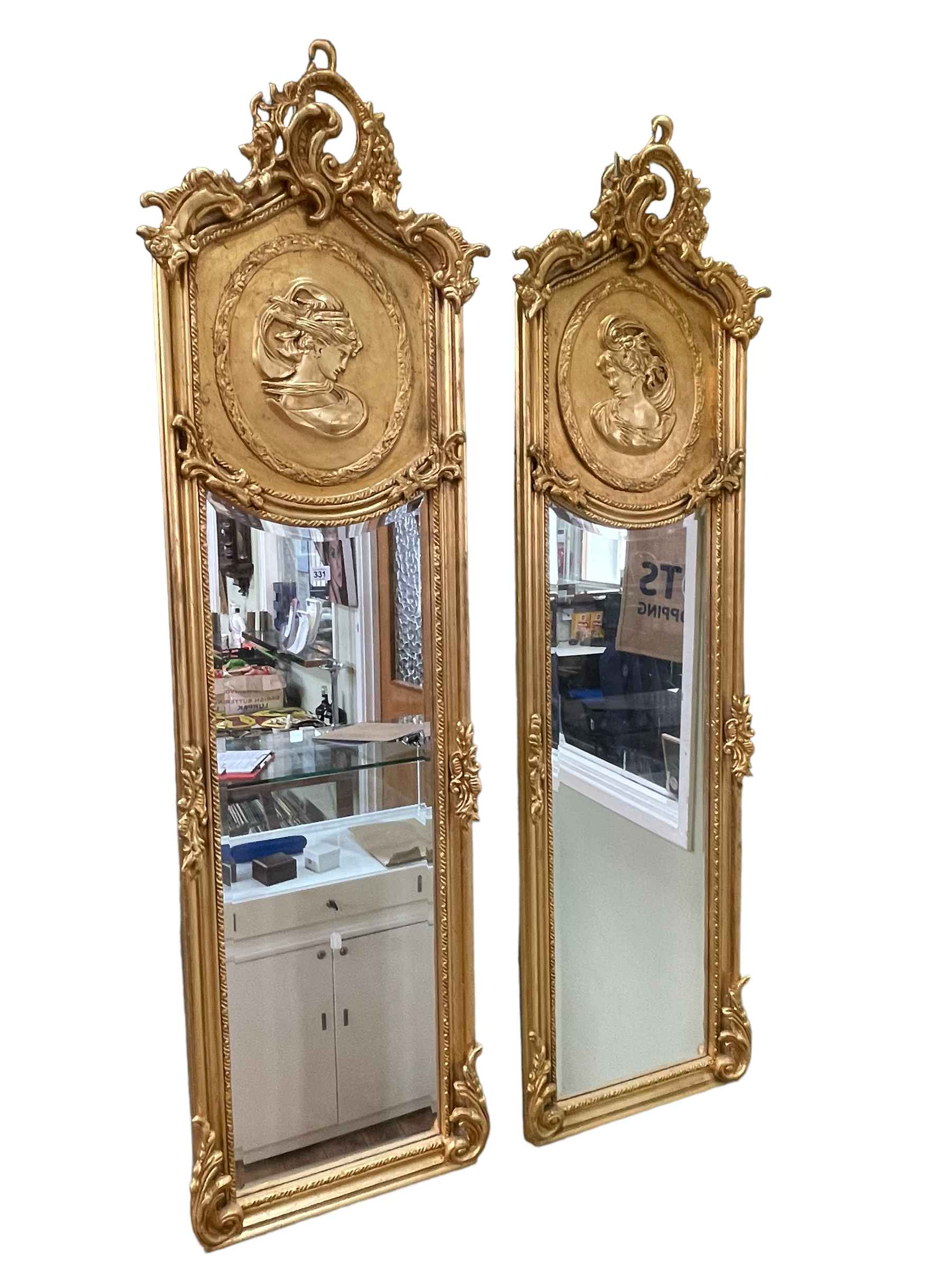 Pair gilt lady portrait rectangular bevelled wall mirrors, 178cm by 53cm.