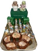 Collection of Beswick Beatrix Potter characters and tree stand.