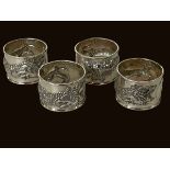 Chinese silver set of four dragon embossed napkin rings.