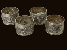 Chinese silver set of four dragon embossed napkin rings.