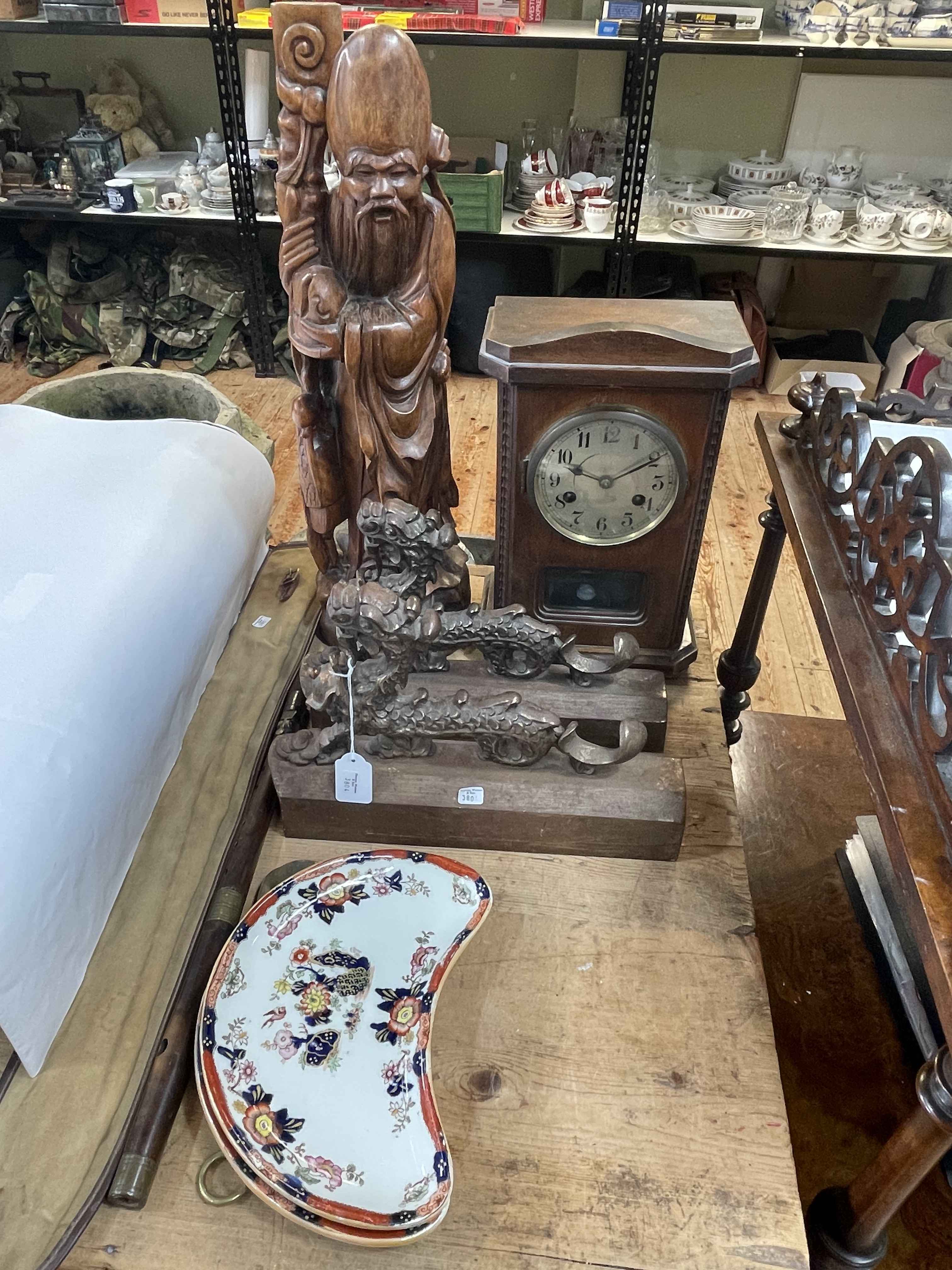 Pair of cast metal Oriental dragon fender ends, carved elder, mahogany mantel clock, flute, etc.