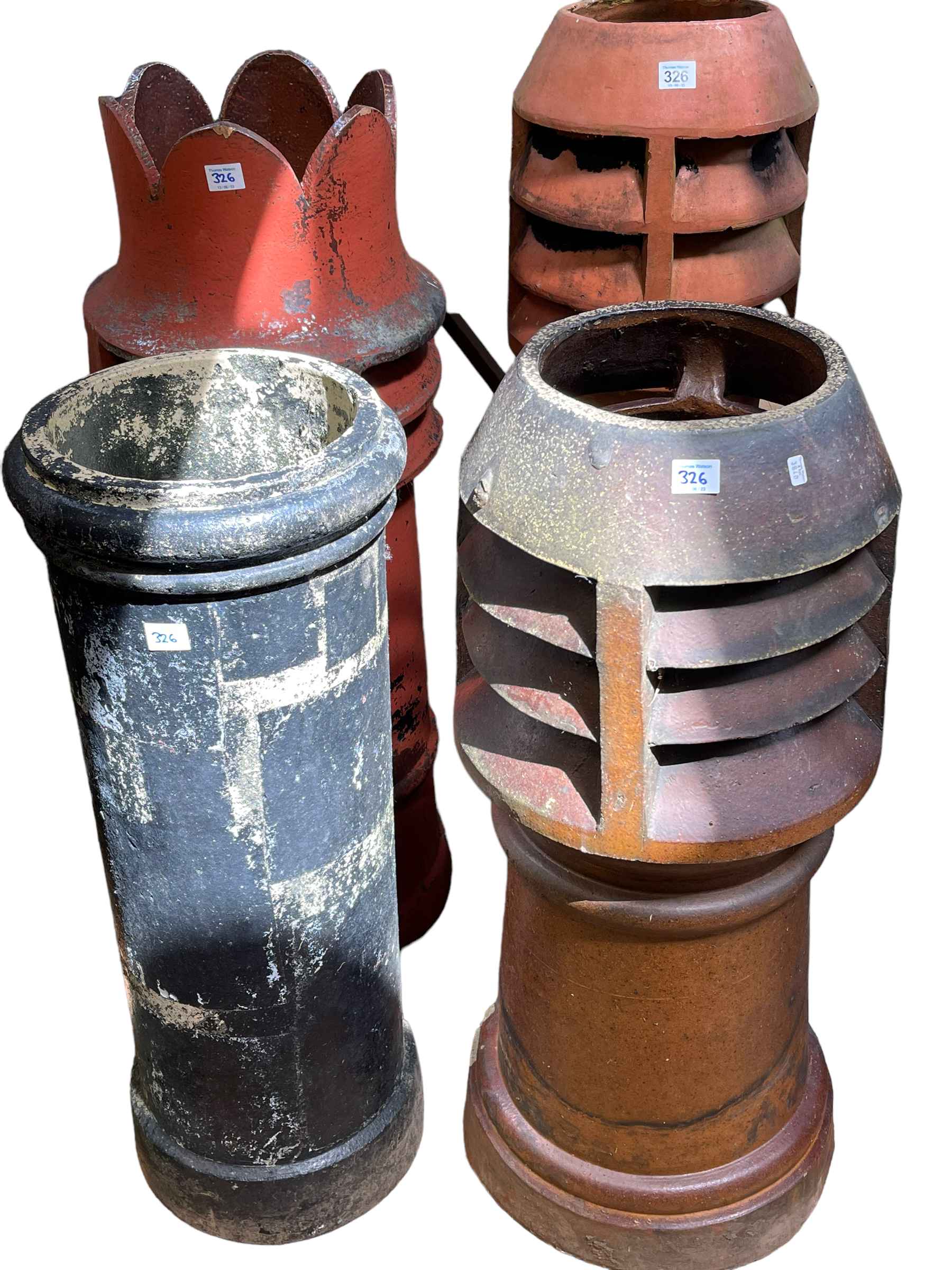 Four various chimney pots including three aerated, tallest 105cm.