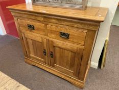 Golden oak two door sideboard, 83cm by 97.5cm by 42.5cm.