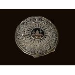 Continental filigree and niello compact with internal lid and mirror, 7cm diameter.