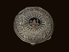 Continental filigree and niello compact with internal lid and mirror, 7cm diameter.