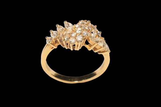 18 carat yellow gold claw set diamond cluster ring set with 16 round brilliant cut diamonds and