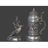 Ornate pewter tankard and an EP silver spill bird holder.