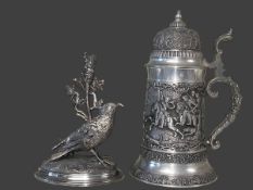 Ornate pewter tankard and an EP silver spill bird holder.