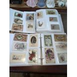 Two partially filled albums of Christmas and New Year greetings cards, Xmas postcards inc Santa,