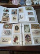 Two partially filled albums of Christmas and New Year greetings cards, Xmas postcards inc Santa,