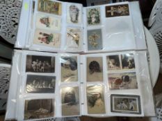 Two partially filled albums of postcards inc Easter German illustrated,