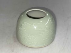 Chinese Celadon brush washer with raised decoration of bats in flight, 7cm high,