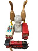 Pair of kissing ducks, phrenology head, tin style campervan, train and bus.