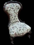 Victorian mahogany framed nursing chair in floral tapestry fabric.