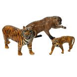 Large Beswick Puma on rock 1702, 21cm high, together with Beswick Tiger and cub (3).