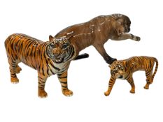 Large Beswick Puma on rock 1702, 21cm high, together with Beswick Tiger and cub (3).