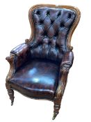 Victorian mahogany framed button backed and studded leather library chair.