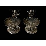 Pair of musical figural shell silver salts.