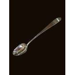 Irish silver basting spoon by Christopher Eades, Dublin 1821, bearing crest, 31cm length.