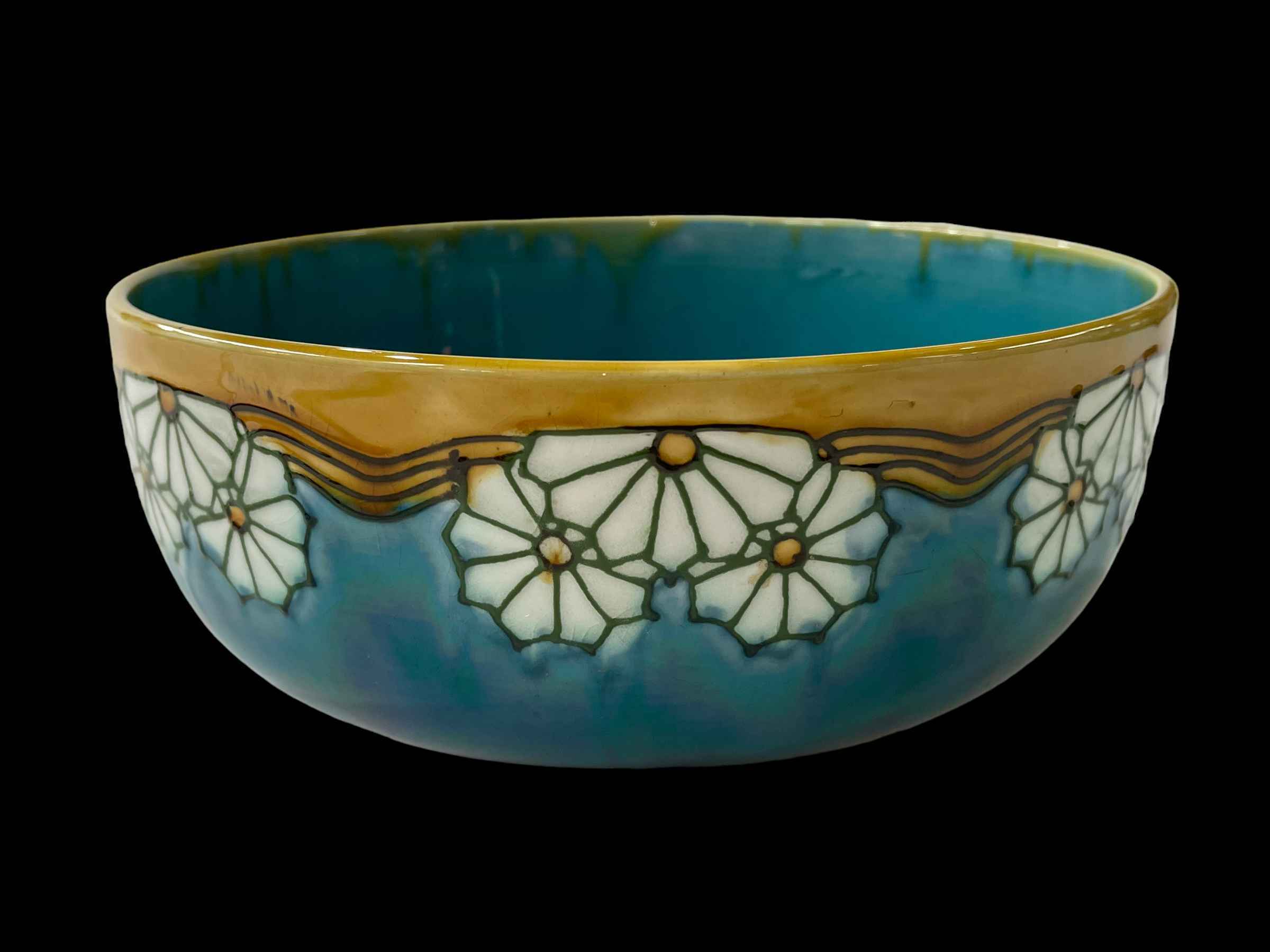 Minton Secessionist bowl decorated with daisy on turquoise ground, number 32, c1910.