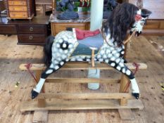 Sponge painted rocking horse on safety stand, 120cm by 137cm.