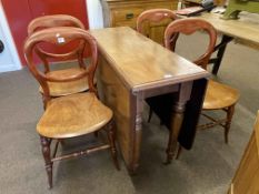 Victorian mahogany drop leaf dining table and set of four balloon back chairs.