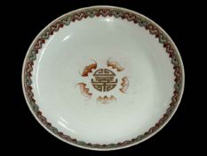 Chinese circular dish with bat design, floral base border and four character mark, 21cm diameter.