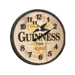 Guinness advert barrel lid wall clock, 57cm.