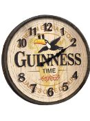 Guinness advert barrel lid wall clock, 57cm.