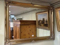 Rectangular gilt framed bevelled wall mirror, 76cm by 105cm.