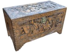 Oriental carved camphor wood trunk, 60cm by 104cm by 52cm.