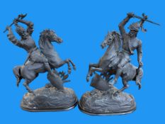 Pair of spelter warriors on horseback, 52cm high.