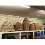Collection of wicker baskets, wooden sculptures, cages, ornate pottery vases, hanging lantern,