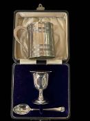 Georgian silver christening mug, London 1800, silver egg cup and spoon, boxed.
