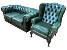 Bottle green buttoned and studded leather two seater Chesterfield settee and wing armchair.