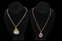 Two agate pendants set in 9 carat gold mounts, each on 9 carat gold link chains.