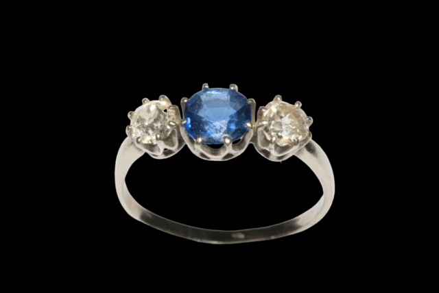 Platinum shank and 18 carat white gold setting sapphire and diamond three stone ring,