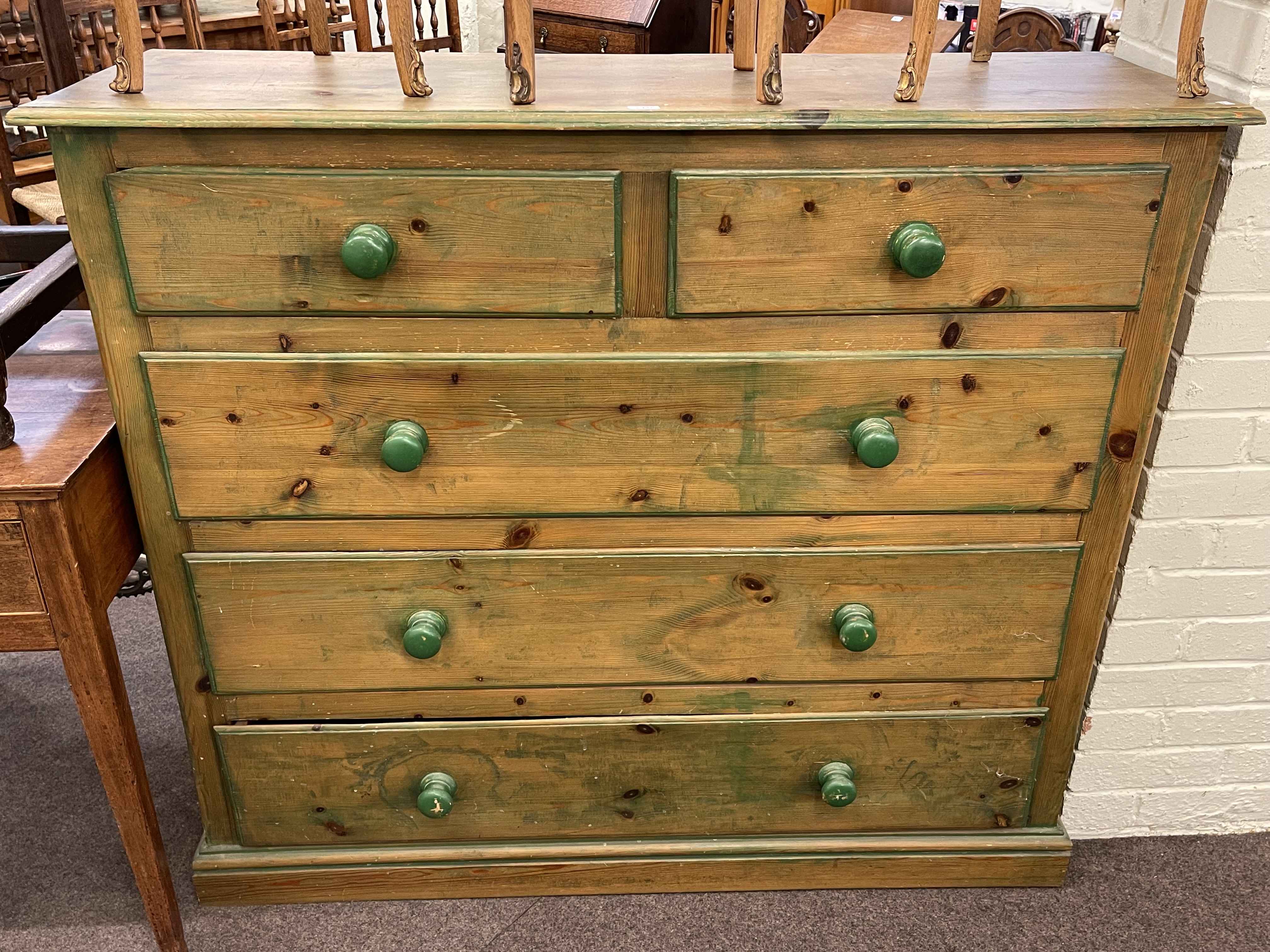Pine chest of two short above three long drawers, 107cm by 122cm by 40cm.