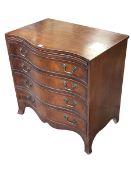Mahogany and satinwood banded serpentine front chest having brush slide above four long drawers on