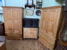 Pine four piece bedroom suite comprising two double door combination wardrobes,