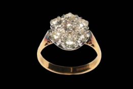 Seven stone diamond petal design ring, the diamonds claw set in white gold to yellow gold shank,