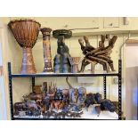 Collection of Ethnic wood carvings, drums, masks, elephant stool, CD stand.