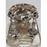 Large embossed silver plated punch bowl, cups and ladle, pair of telescopic embossed candlesticks,